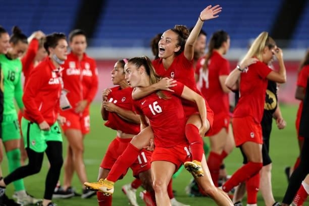 Janine Beckie celebrates with Julia Grosso following their victory to gold medal in the Gold Medal Match Women's Football match between Canada and...