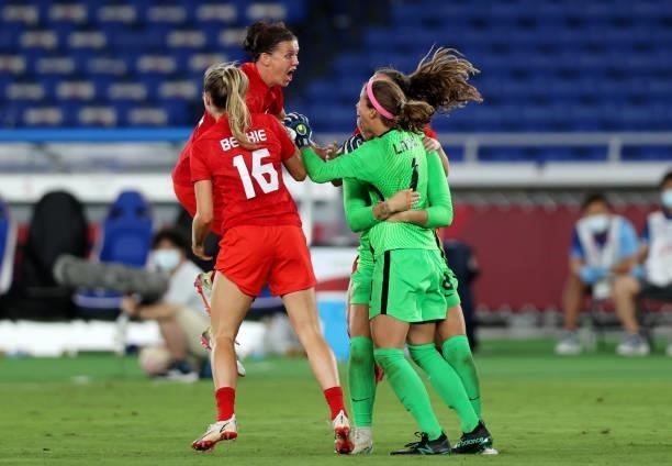Christine Sinclair , Stephanie Labbe , Janine Beckie celebrate with Julia Grosso following their victory to gold medal in the Gold Medal Match...