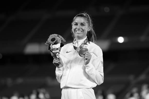 Alex Morgan of Team USA poses with her Bronze medal after the Gold Medal Match Women's Football match between Canada and Sweden at International...