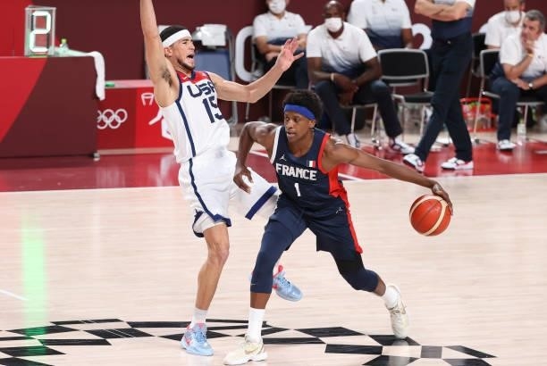 Frank Ntilikina of France, Devin Booker of USA during the Men's Basketball Gold Medal Final between United States and France on day fifteen of the...