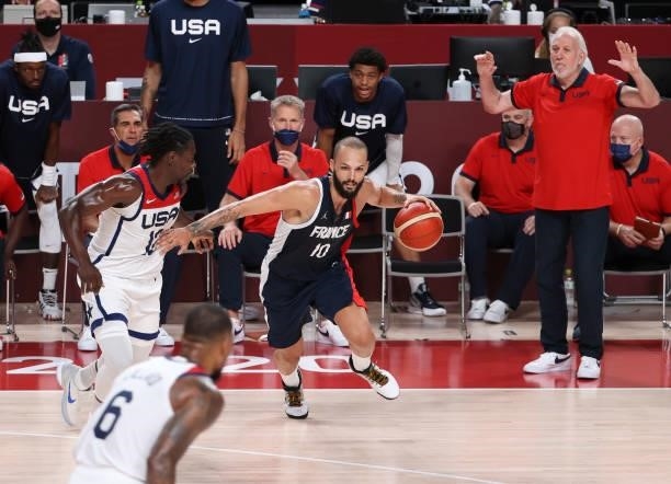 Evan Fournier of France, Coach of Team USA Gregg Popovich during the Men's Basketball Gold Medal Final between United States and France on day...