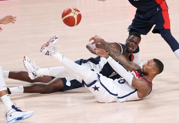 Damian Lillard of USA, Moustapha Fall of France during the Men's Basketball Gold Medal Final between United States and France on day fifteen of the...