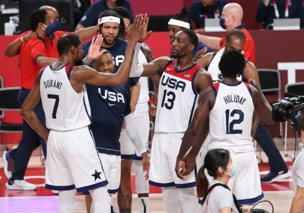 Kevin Durant, Bam Adebayo of USA celebrate the victory following the Men's Basketball Gold Medal Final between United States and France on day...