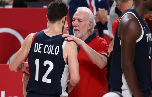 Coach of Team USA Gregg Popovich talks to Nando de Colo of France following the Men's Basketball Gold Medal Final between United States and France on...