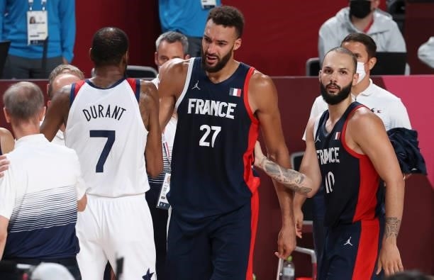 Kevin Durant of USA salutes Rudy Gobert of France crying, consoled by Evan Fournier of France following the French defeat in the Men's Basketball...