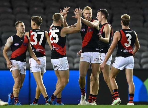Peter Wright of the Bombers is congratulated by team mates after kicking a goal during the round 21 AFL match between Western Bulldogs and Essendon...