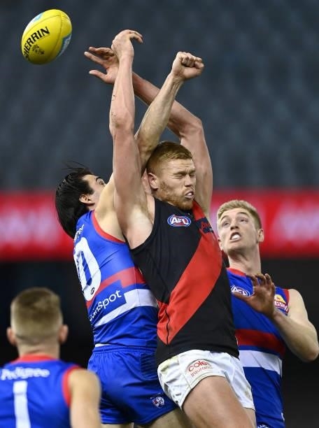 Easton Wood of the Bulldogs spoils a mark by Peter Wright of the Bombers during the round 21 AFL match between Western Bulldogs and Essendon Bombers...