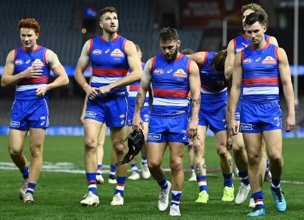 The Bulldogs look dejected after losing the round 21 AFL match between Western Bulldogs and Essendon Bombers at Marvel Stadium on August 08, 2021 in...