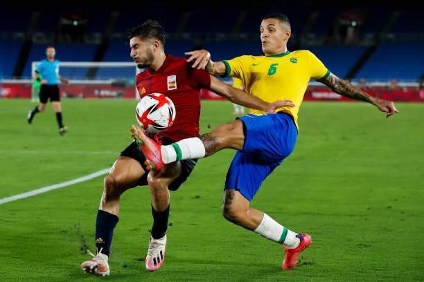 Guilherme Arana of Brazil competes fot the ball with Oscar Gil of Spain during the Men's Gold Medal Match between Brazil and Spain on day fifteen of...