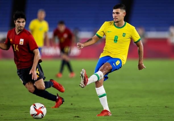 Bruno Guimaraes of Brazil pass the ball during the Men's Gold Medal Match between Brazil and Spain on day fifteen of the Tokyo 2020 Olympic Games at...