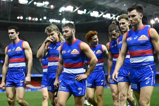 The Bulldogs look dejected after losing the round 21 AFL match between Western Bulldogs and Essendon Bombers at Marvel Stadium on August 08, 2021 in...