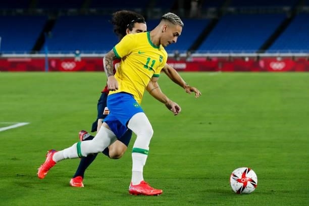 Antony of Brazil competes for the ball during the Men's Gold Medal Match between Brazil and Spain on day fifteen of the Tokyo 2020 Olympic Games at...