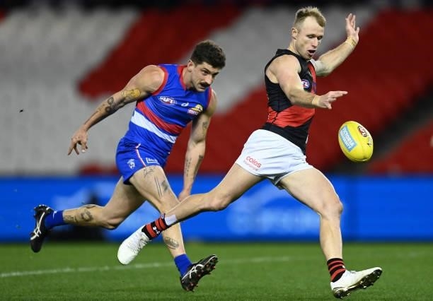 Nick Hind of the Bombers kicks during the round 21 AFL match between Western Bulldogs and Essendon Bombers at Marvel Stadium on August 08, 2021 in...