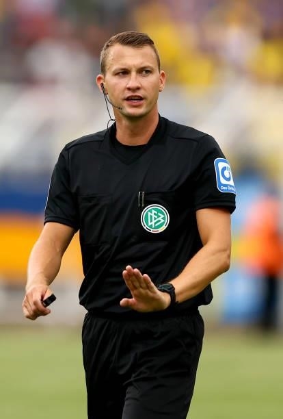 Referee Florian Lechner gestures during the DFB Cup first round match between 1. FC Lok Leipzig and Bayer Leverkusen at Bruno Plache Stadion on...