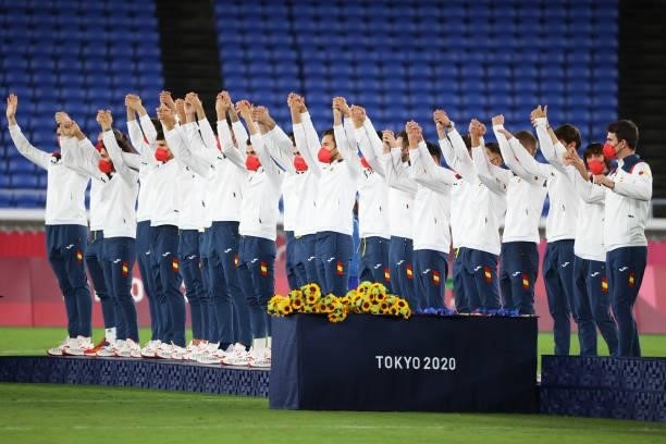 Team Mexico waves during the medal ceremony prior to receiving their bronze medals at International Stadium Yokohama on August 07, 2021 in Yokohama,...