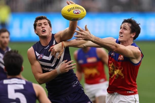 Lloyd Meek of the Dockers and Oscar McInerney of the Lions contest the ruck during the round 21 AFL match between Fremantle Dockers and Brisbane...