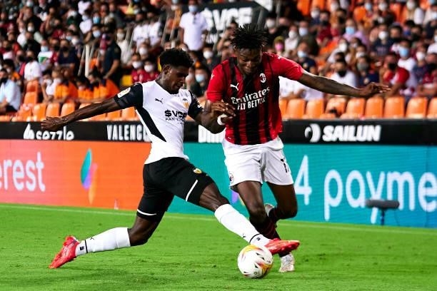 Thierry Correia of Valencia CF competes for the ball with Rafael Leao of AC Milan during a pre-season friendly match between Valencia CF and AC Milan...