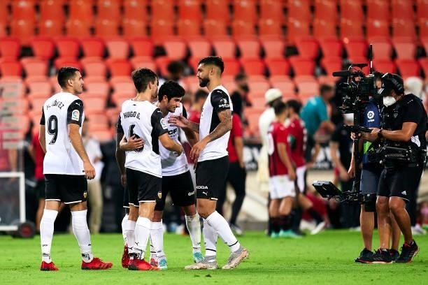 Players of Valencia CF celebrate the victory after a pre-season friendly match between Valencia CF and AC Milan at Estadi de Mestalla on August 04,...