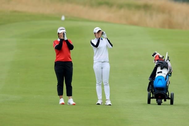 Aprichaya Yubol of Thailand and Pannarat Thanapolboonyaras of Thailand wait to play their third shots on the third hole during the Rose Ladies Series...