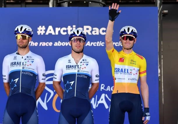 Sebastian Berwick of Australia, Rudy Barbier of France & Ben Hermans of Belgium and Team Israel Start-Up Nation Yellow Leader Jersey prior to the 8th...