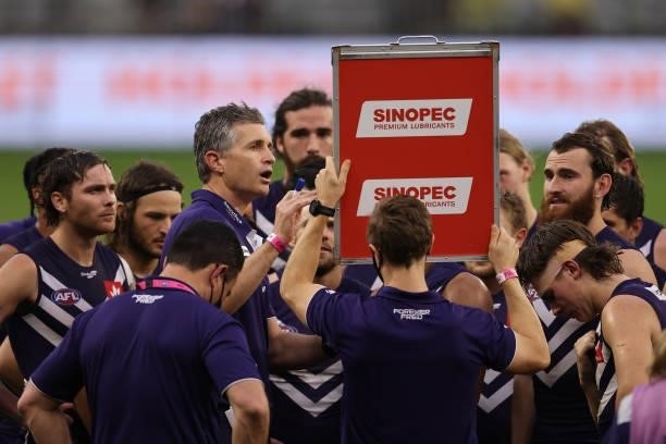 Justin Longmuir, head coach of the Dockers addresses his players at the three quarter time break during the round 21 AFL match between Fremantle...