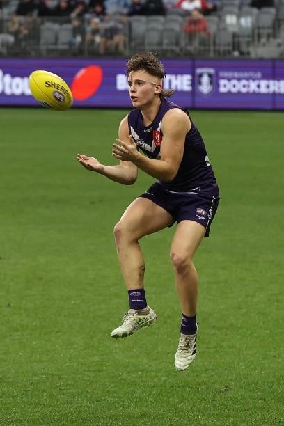 Caleb Serong of the Dockers marks the ball during the round 21 AFL match between Fremantle Dockers and Brisbane Lions at Optus Stadium on August 08,...