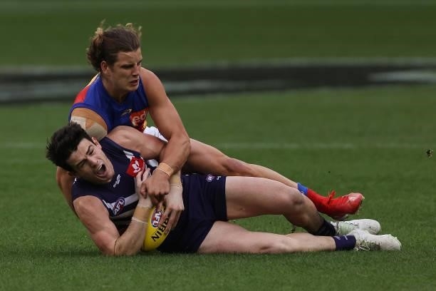 Jarrod Berry of the Lions tackles Andrew Brayshaw of the Dockers during the round 21 AFL match between Fremantle Dockers and Brisbane Lions at Optus...