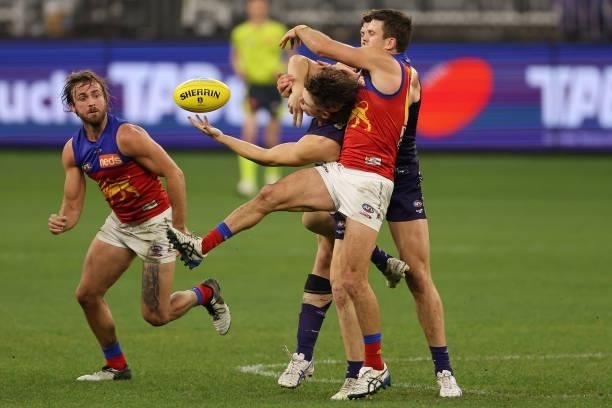 Caleb Serong of the Dockers contests for the ball during the round 21 AFL match between Fremantle Dockers and Brisbane Lions at Optus Stadium on...