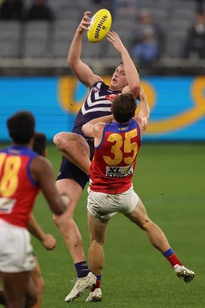 Josh Treacy of the Dockers contests for a mark against Ryan Lester of the Lions during the round 21 AFL match between Fremantle Dockers and Brisbane...