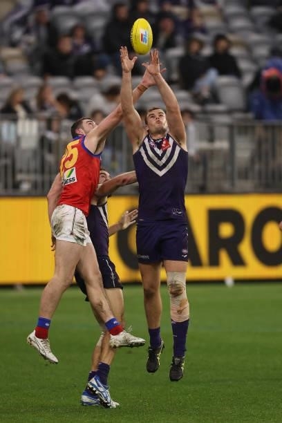 Sean Darcy of the Dockers marks the ball against Daniel McStay of the Lions during the round 21 AFL match between Fremantle Dockers and Brisbane...