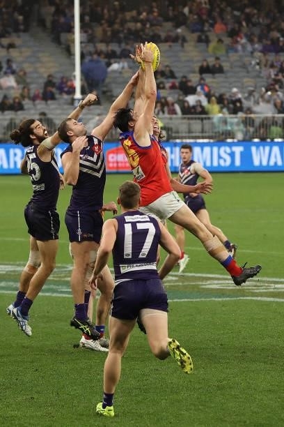 Oscar McInerney of the Lions marks the ball during the round 21 AFL match between Fremantle Dockers and Brisbane Lions at Optus Stadium on August 08,...