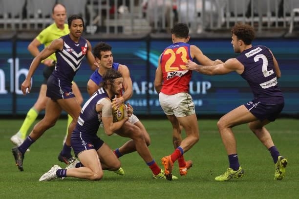 James Aish of the Dockers marks the ball during the round 21 AFL match between Fremantle Dockers and Brisbane Lions at Optus Stadium on August 08,...