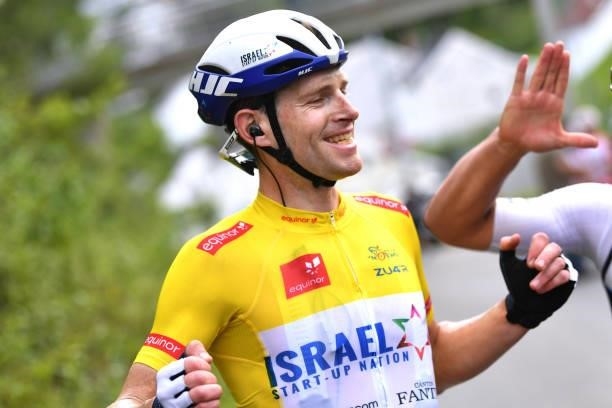 Ben Hermans of Belgium and Team Israel Start-Up Nation Yellow Leader Jersey celebrates at finish line with Teammates as race winner during the 8th...