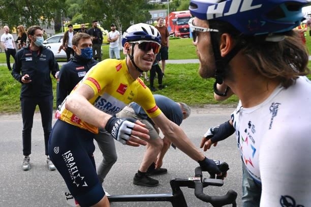 Ben Hermans of Belgium and Team Israel Start-Up Nation Yellow Leader Jersey celebrates at finish line as race winner with Rick Zabel of Germany and...