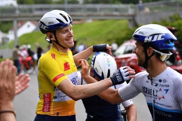 Ben Hermans of Belgium and Team Israel Start-Up Nation Yellow Leader Jersey celebrates at finish line with Teammates as race winner during the 8th...
