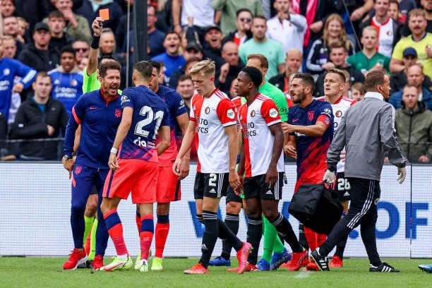 Referee Dennis Higler shows red card to Yannick Carrasco of Atletico Madrid after a conflict between players of Feyenoord and Atletico Madrid during...