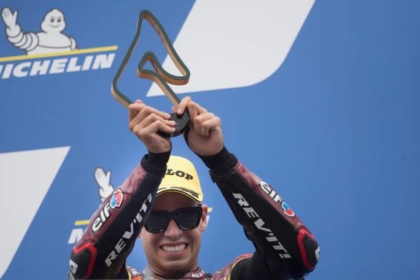 Augusto Fernandez of Spain and Elf Marc VDS Racing Team celebrates the third place on the podium at the end of the Moto2 race during the MotoGP of...