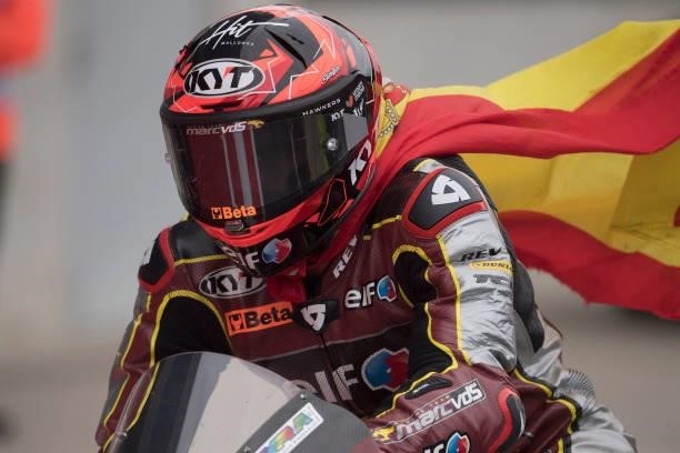 Augusto Fernandez of Spain and Elf Marc VDS Racing Team celebrates the third place with flag during the Moto2 race during the MotoGP of Styria - Race...