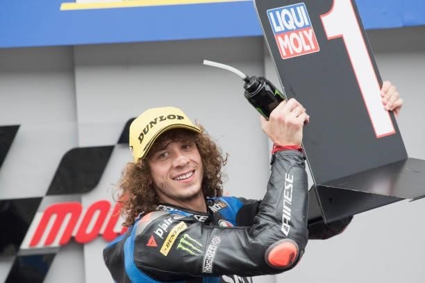 Marco Bezzecchi of Italy and Sky Racing Team VR46 celebrates the victory under the podium at the end of the Moto2 race during the MotoGP of Styria -...