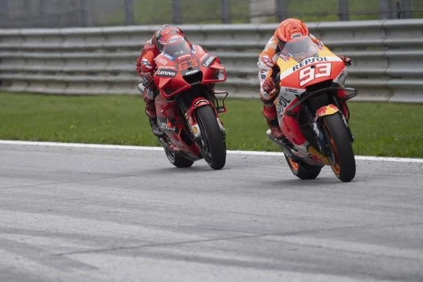 Marc Marquez of Spain and Repsol Honda Team leads Francesco Bagnaia of Italy and Ducati Lenovo Team during the MotoGP race during the MotoGP of...