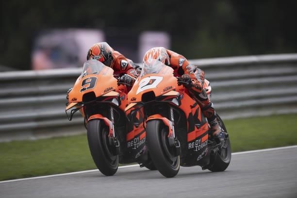 Danilo Petrucci of Italy and Red Bull KTM Factory Racing leads Iker Lequona of Spain and Red Bull KTM Factory Racing during the MotoGP race during...