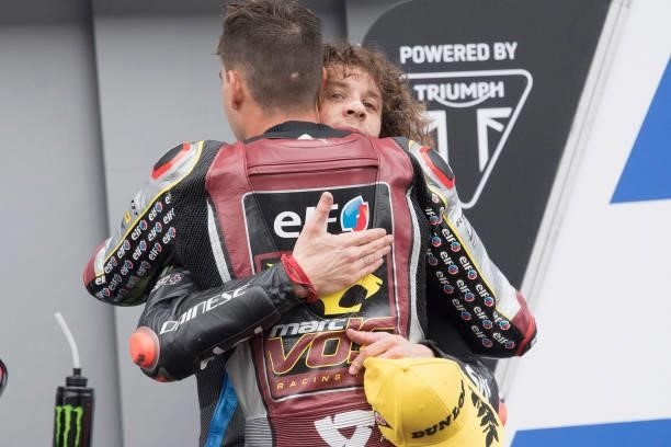 Augusto Fernandez of Spain and Elf Marc VDS Racing Team hugs Marco Bezzecchi of Italy and Sky Racing Team VR46 at the end of the Moto2 race during...