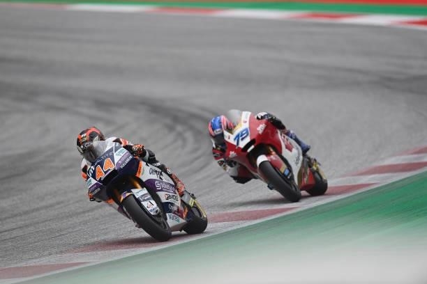Aron Canet of Spain and Inde Aspar Team leads Ai Ogura of Japan and Idemitsu Honda Team Asia during the Moto2 race during the MotoGP of Styria - Race...