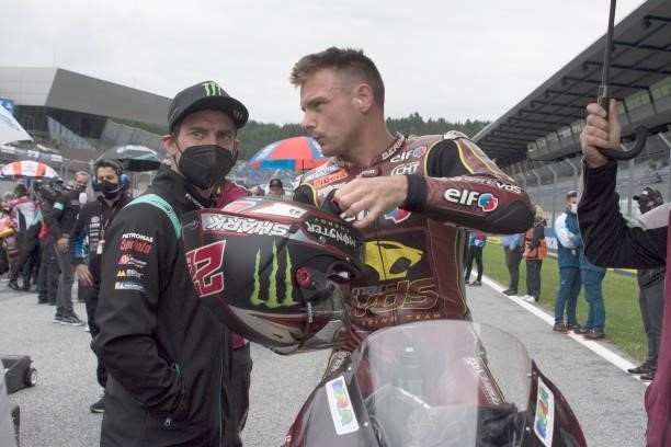 Sam Lowes of Great Britain and Elf Marc VDS Racing Team speaks on grid with Cal Crutchlow of Great Britain and Petronas Yamaha SRT during the Moto2...
