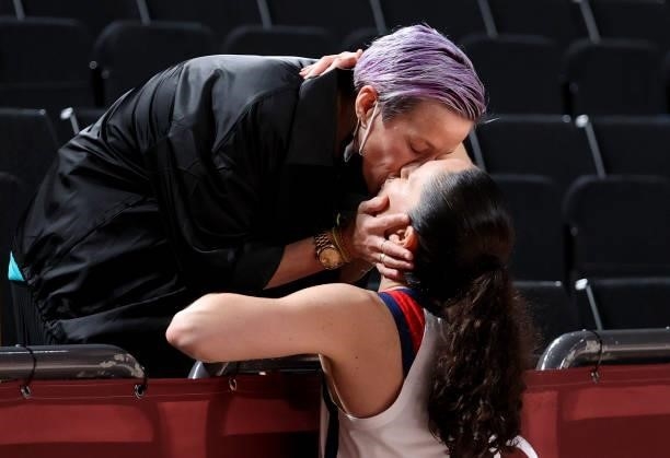 Megan Rapinoe kisses her fiancee Sue Bird after she won the Gold Medal following the Women's Basketball Gold Medal Final between United States and...