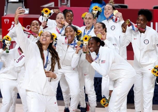 Brittney Griner of USA takes a selfie with teammates during the medal ceremony of the Women's Basketball Gold Medal Final between United States and...