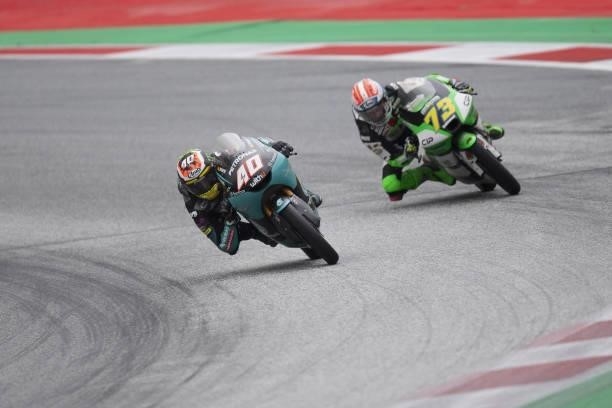 Darryn Binder of South Africa and Petronas Sprinta Racing leads Maximilian Kofler of Austria and CIP Green Powerm during the Moto3 race during the...
