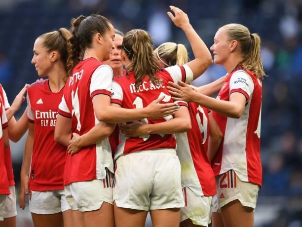 Katie McCabe celebrates scoring Arsenal's 2nd goal with her team mates during the MIND series match between Tottenham Hotspur and Arsenal at...