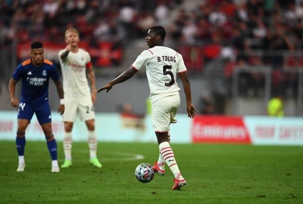 Fode Ballo-Toure of AC Milan in action during the pre-season friendly match between Real Madrid and AC Milan at Worthersee Stadion on August 08, 2021...