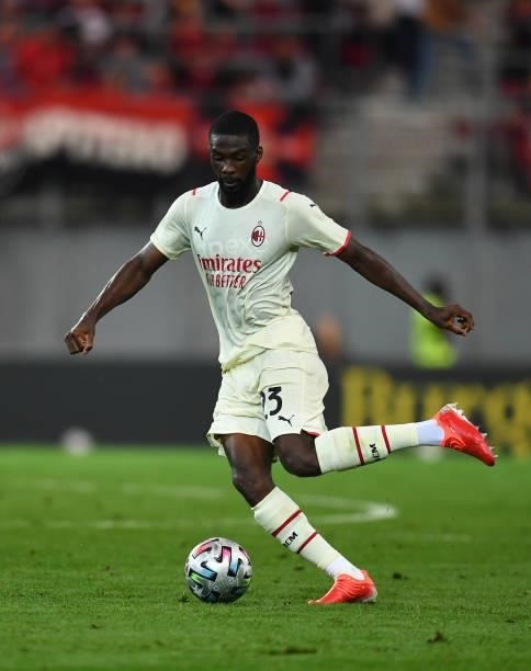 Fode Ballo-Toure of AC Milan in action during the pre-season friendly match between Real Madrid and AC Milan at Worthersee Stadion on August 08, 2021...